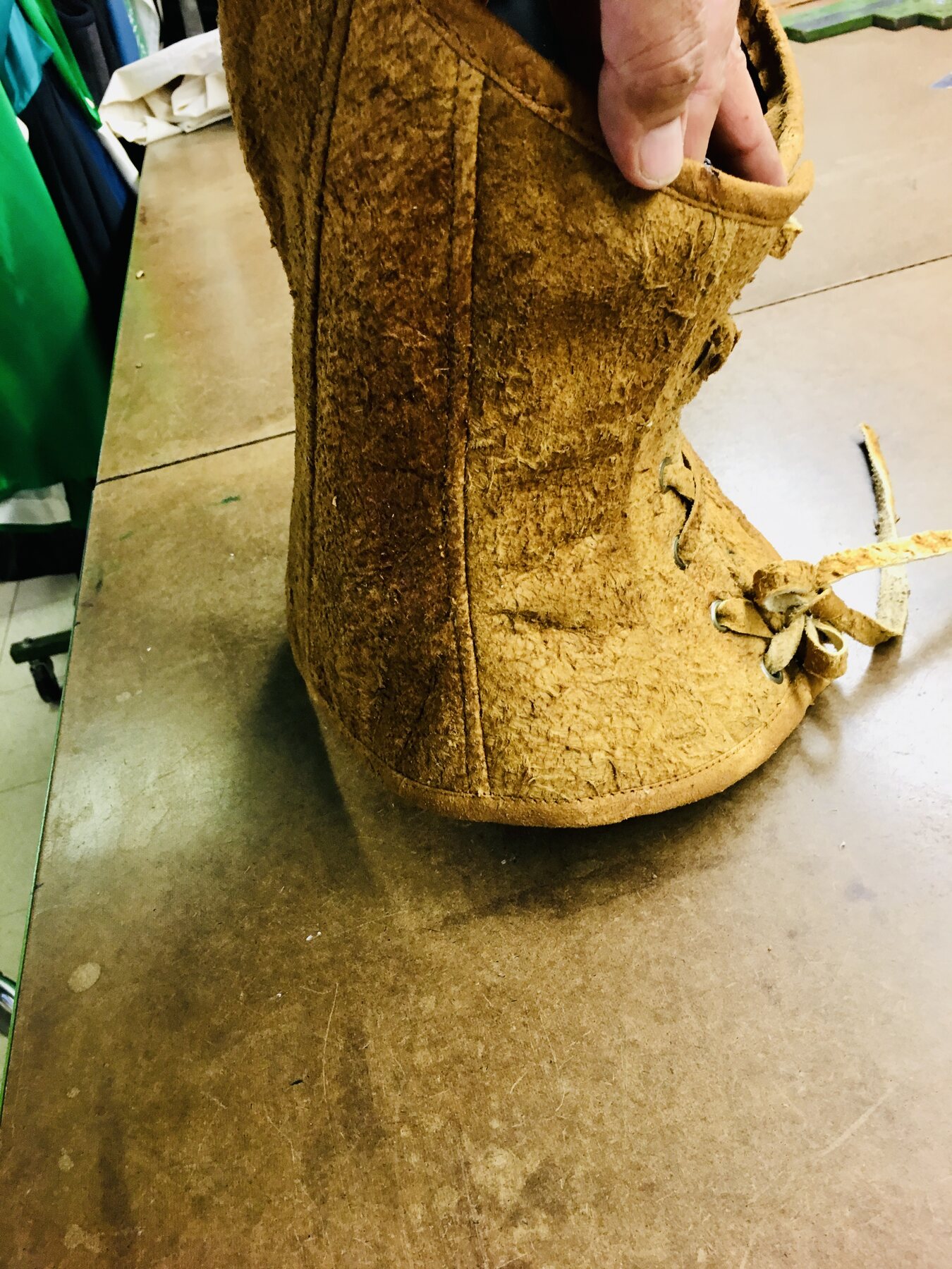 Hide moccasin on a workbench