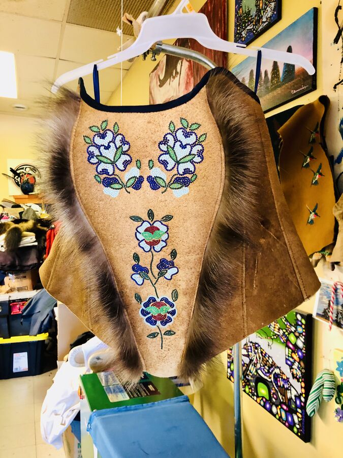 Beaded hide poncho