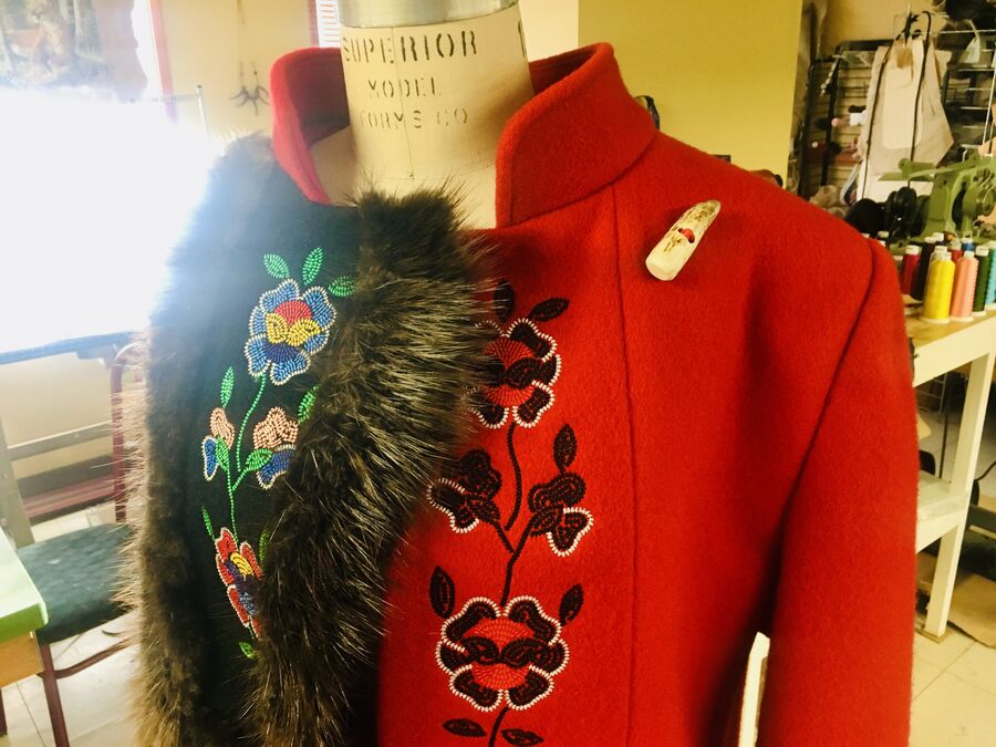 Red wool coat with beaded florals and a fur collar